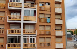 Rear façade with balconies of block A in Can Vilardell before the works